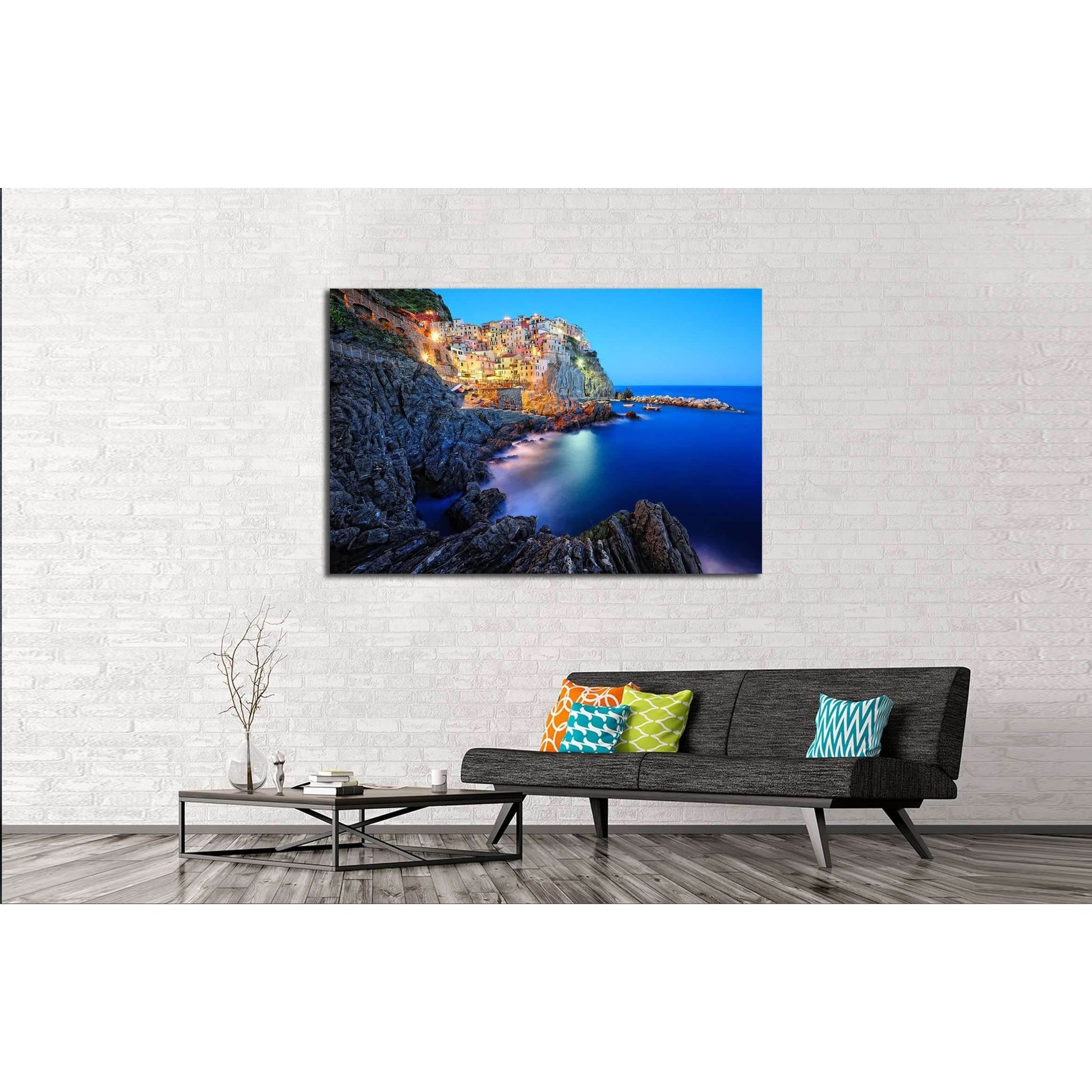 Manarola Cinque Terre Canvas Print - Italian Riviera Wall ArtThis multi-panel canvas print captures the picturesque village of Manarola, part of the Cinque Terre on the Italian Riviera. The vibrant houses perched atop the rugged cliffside, overlooking the